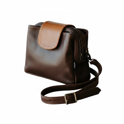 The Lindie Crossbody in dark brown with a Tan Flap
